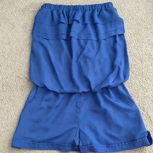 Ruffled strapless romper in a periwinkle